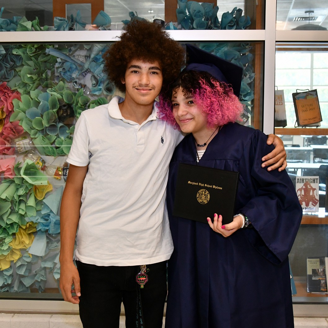Brother Holding His Graduated Sister