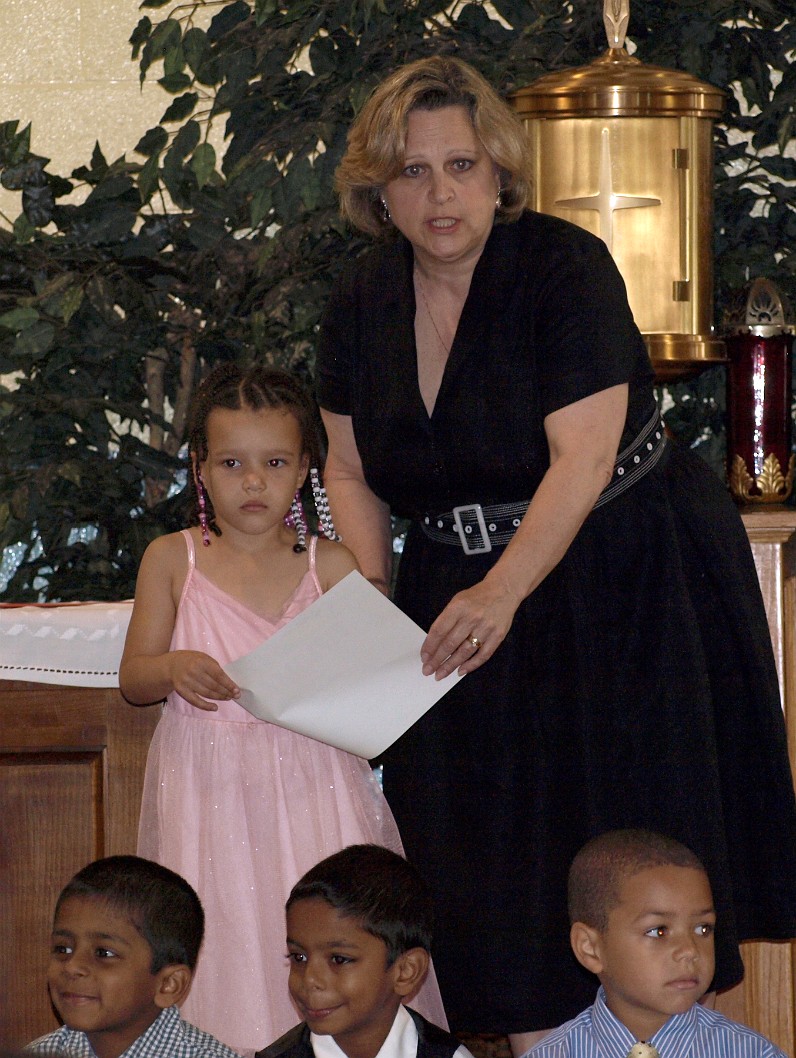 Getting Her Graduation Certificate From Mrs. Menefee Getting Her Graduation Certificate From Mrs. Menefee