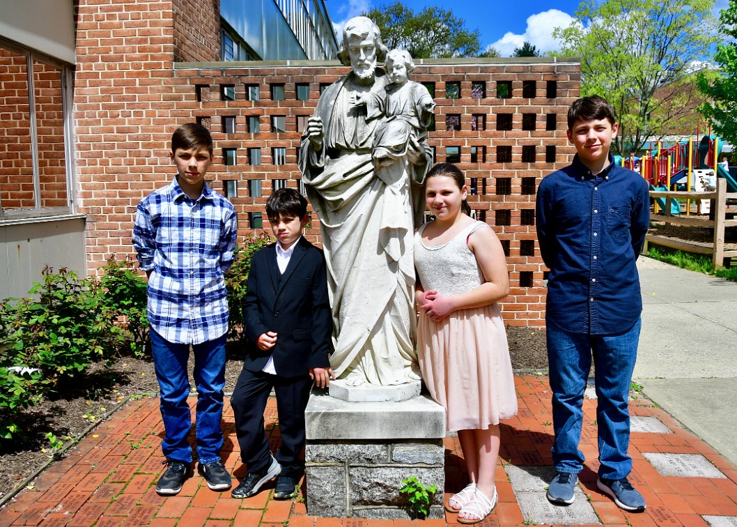 Husk Kids Posing With Saint Joseph and Jesus at OLV